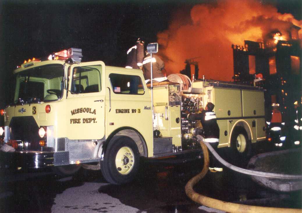 Missoula Fire Engine in front of the Missoula mansion, ablaze in the background on June 11, 1992. 