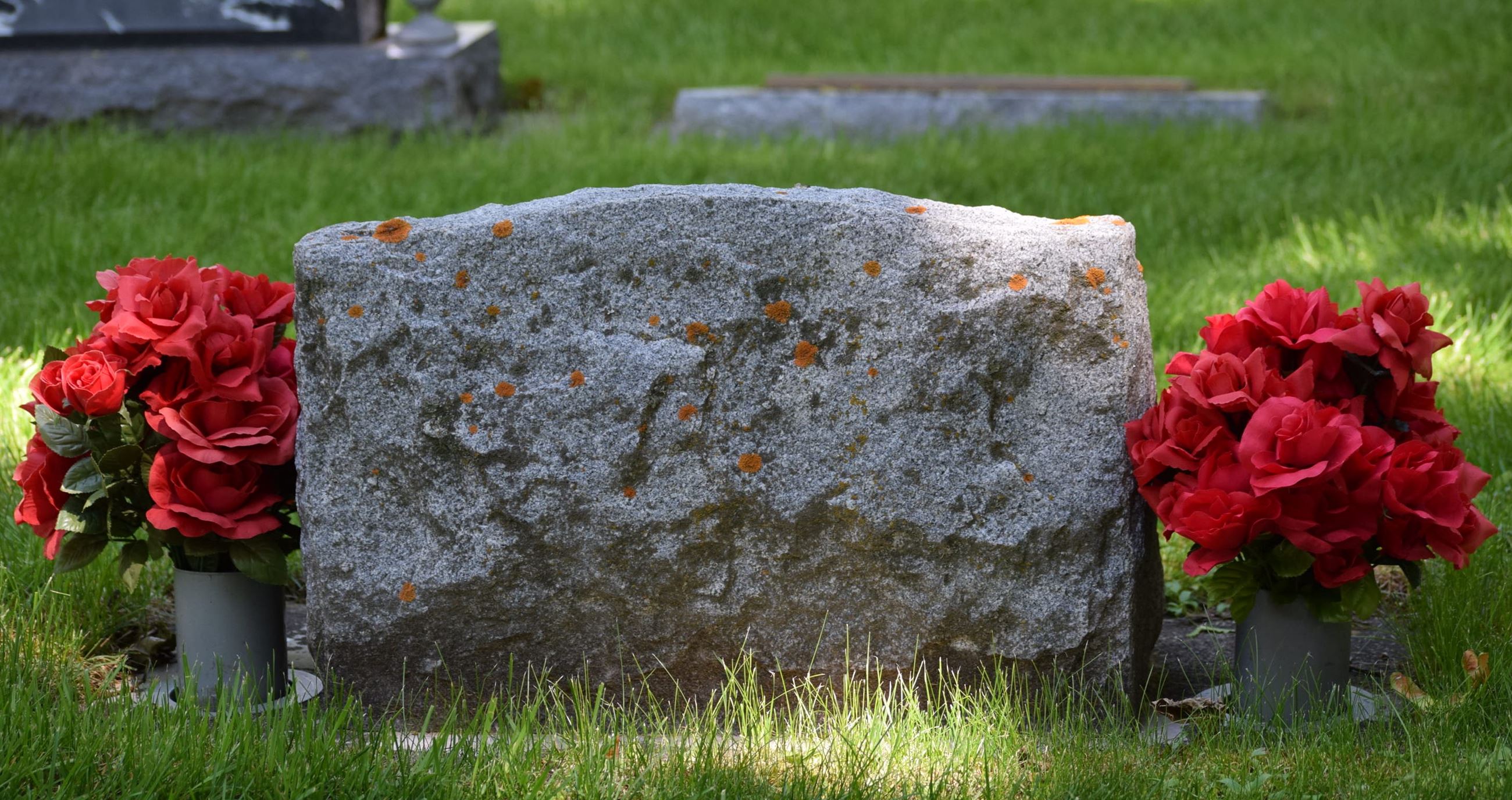 Vases with flowers at monument
